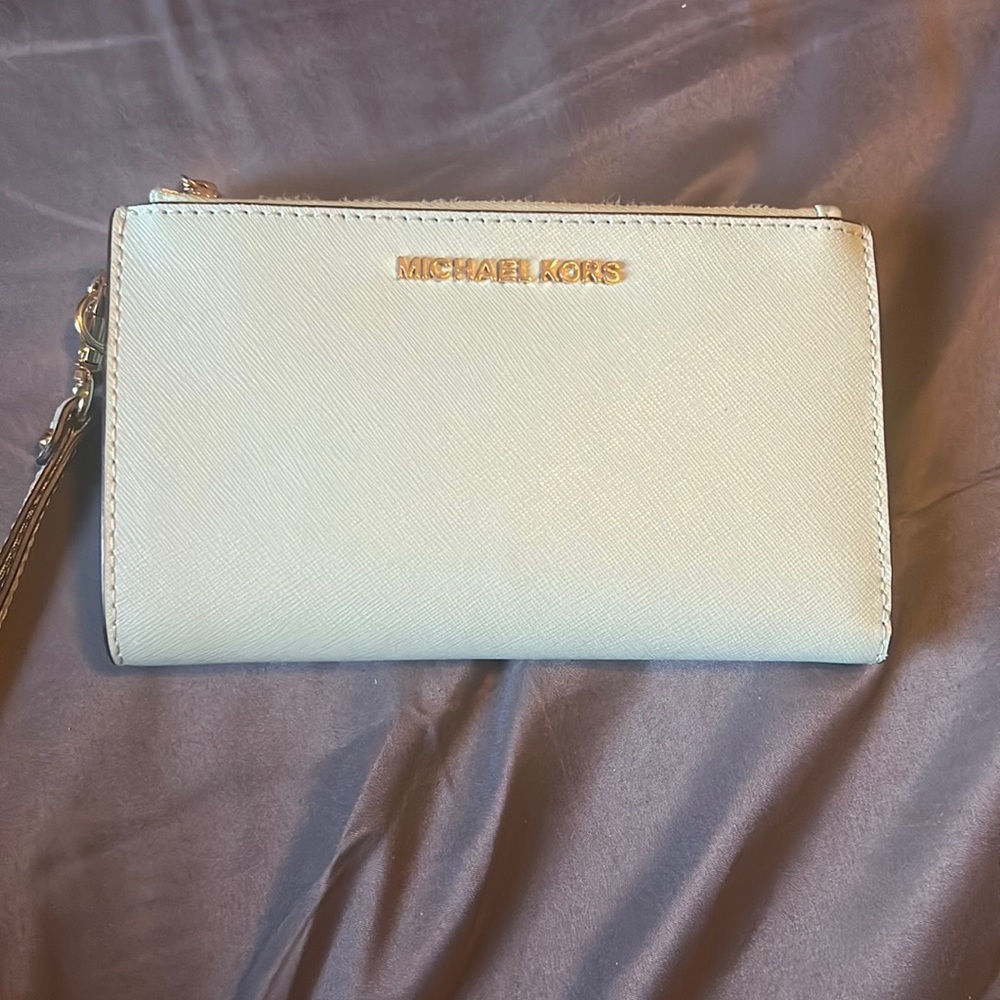 Michael Kors bag that is like a aqua green that is in really good condition.